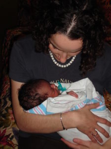 Michelle holding her for the first time